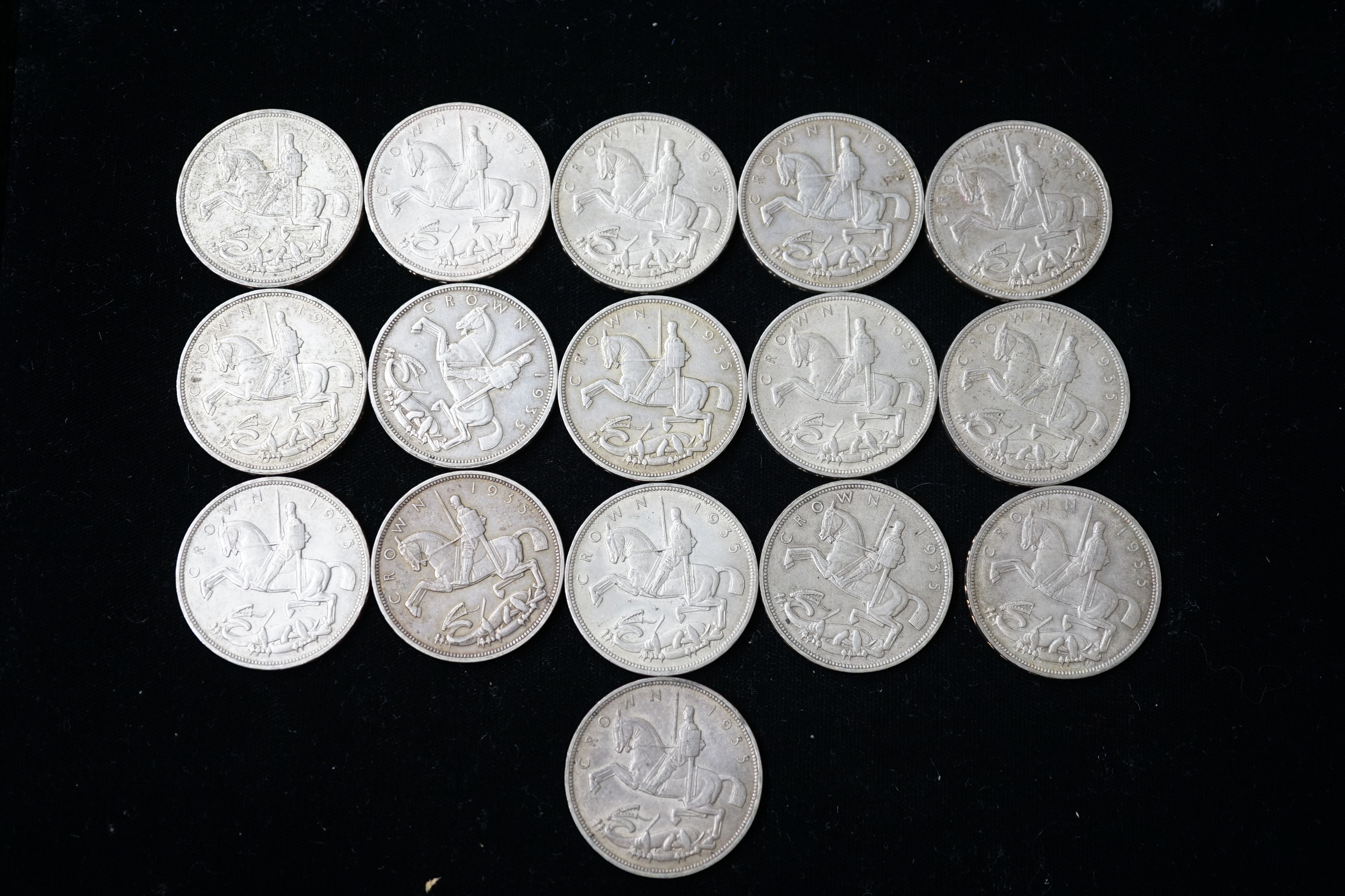 Sixteen George V crowns, 1935, all AEF or better